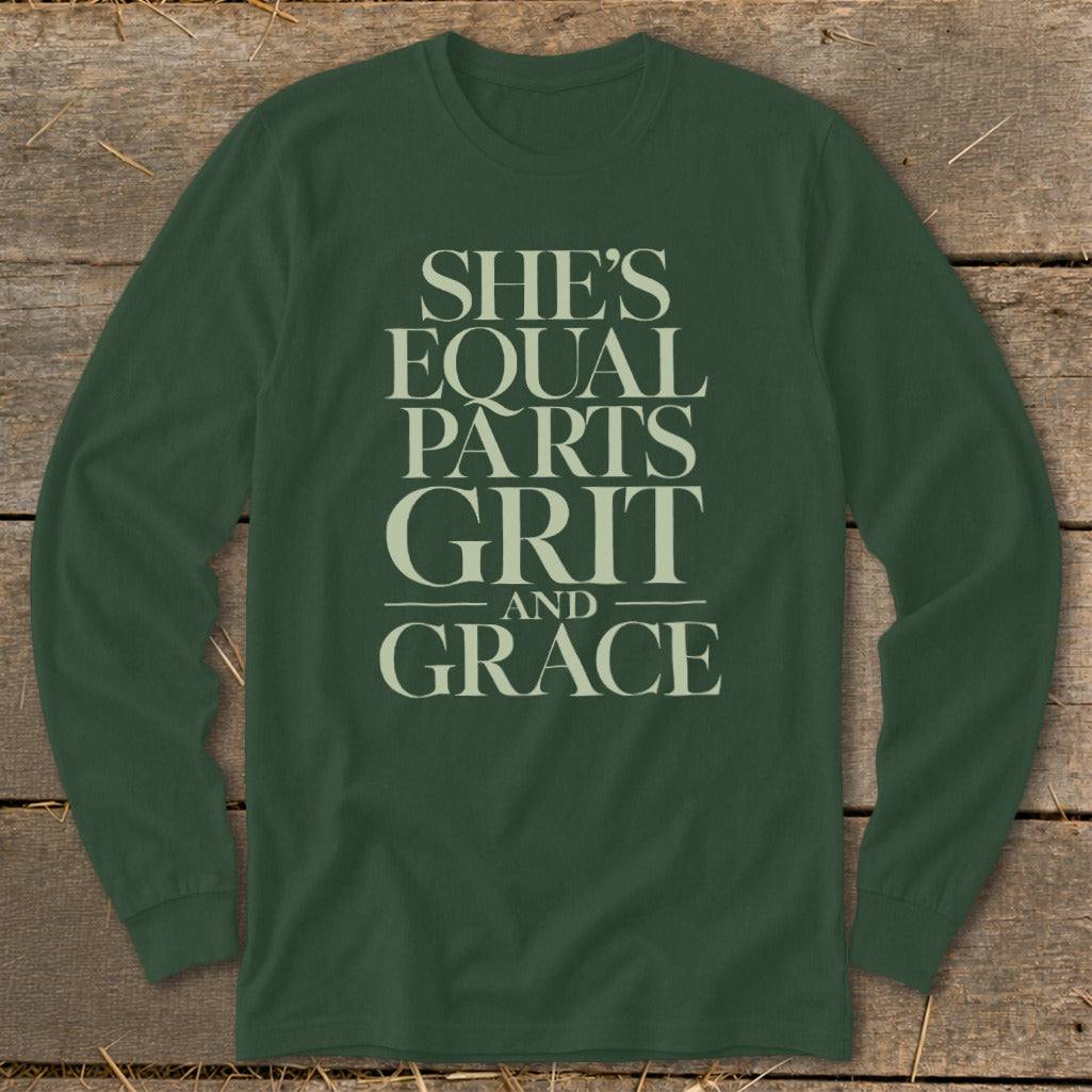 Dark green long-sleeve shirt with text "She's Equal Parts Grit and Grace".