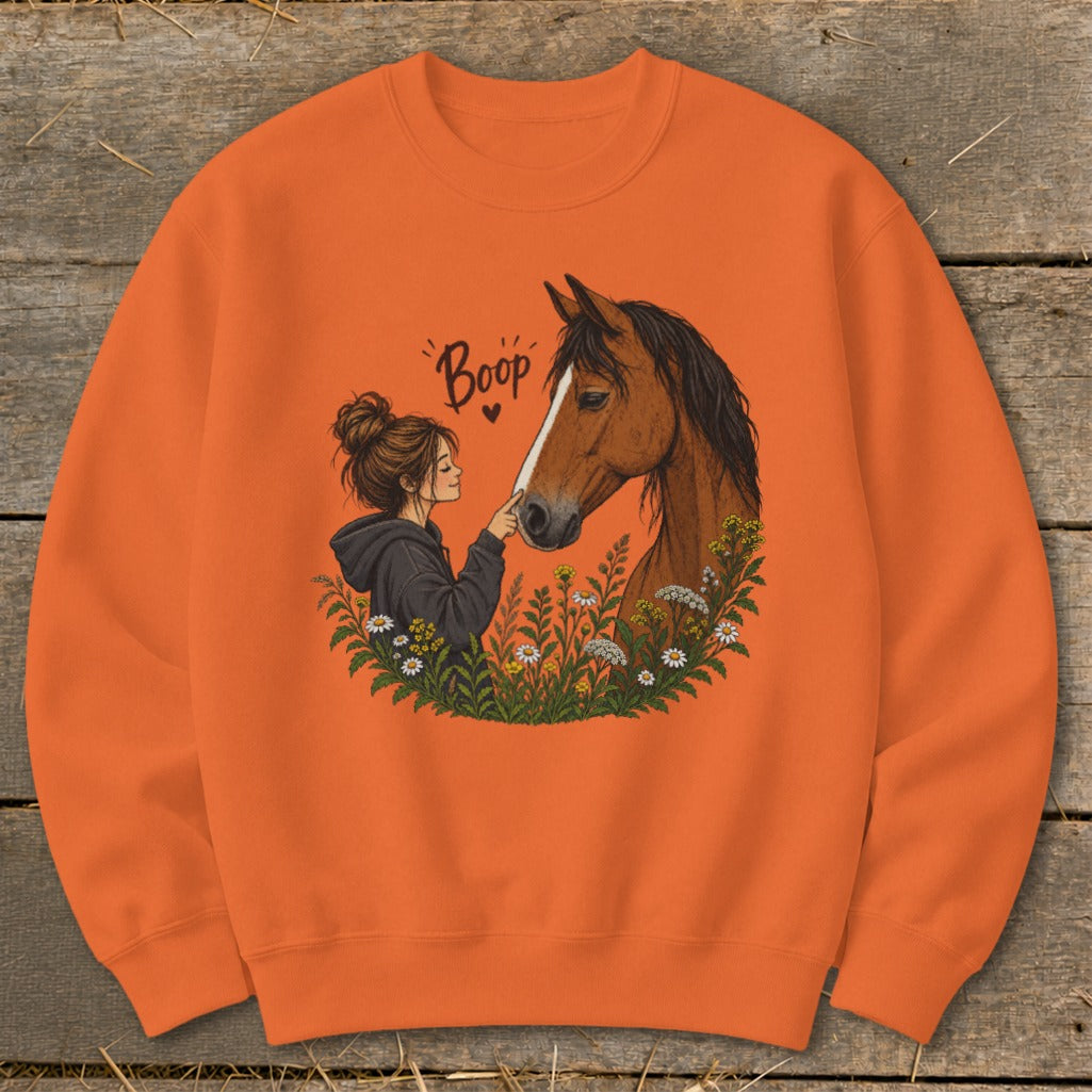 Girl booping horse with text "Boop" and wildflowers.