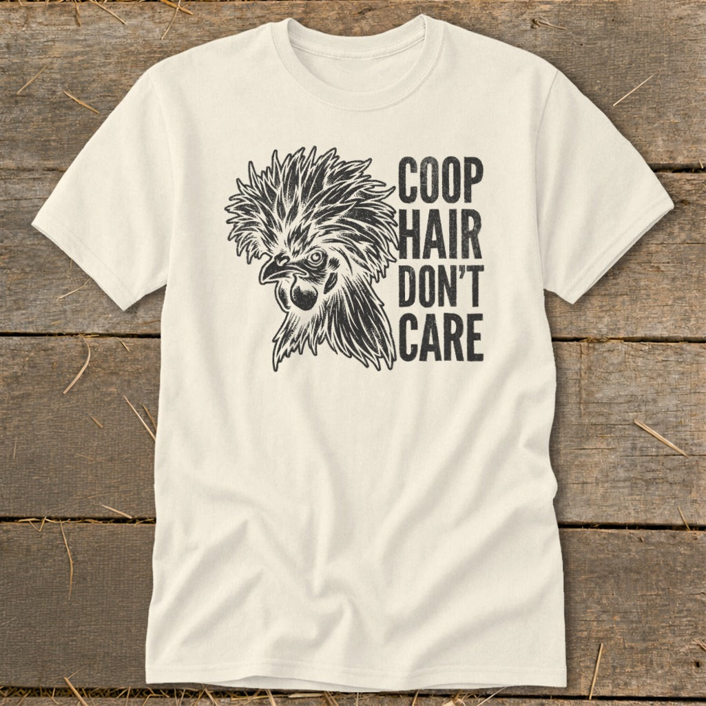Cream t-shirt with black graphic of a chicken head and text "COOP HAIR DON'T CARE".