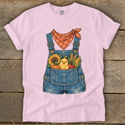 Pink t-shirt with denim overalls graphic featuring a chick, sunflower, pumpkin, apple, and corn.