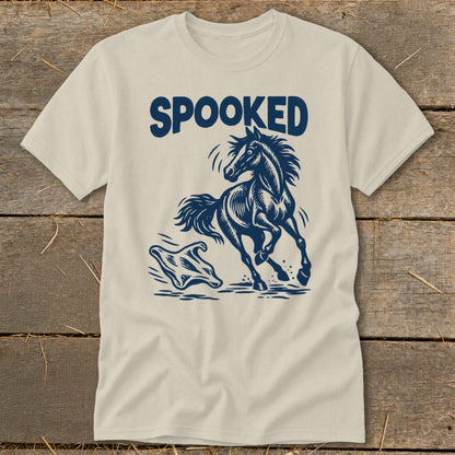 Light beige t-shirt with a dark blue graphic of a running horse and a ghost.