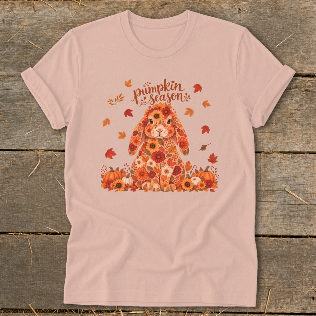 Floral bunny with pumpkins and text "pumpkin season" on a light pink shirt.