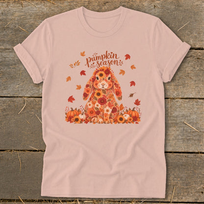 Floral bunny with pumpkins and text "pumpkin season" on a light pink shirt.
