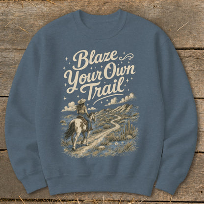 Sweatshirt with "Blaze Your Own Trail" text over a desert landscape with a rider on horseback.