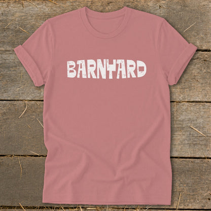 A dusty rose t-shirt with the word "BARNYARD" printed in distressed white text across the chest.