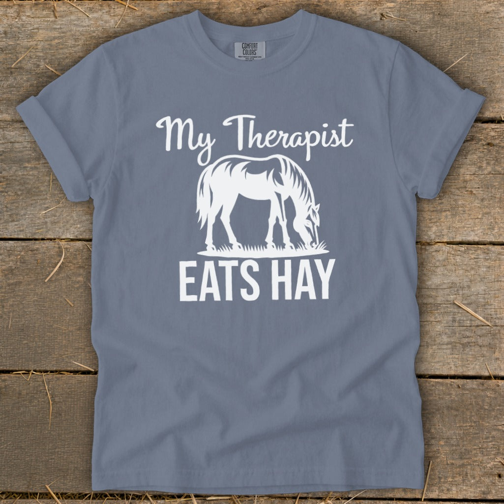 T-shirt with white text "My Therapist EATS HAY" and horse graphic.