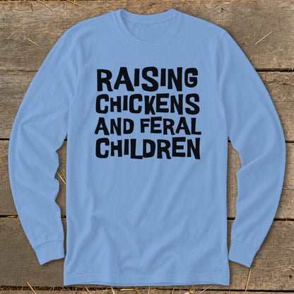 Light blue long-sleeve shirt with black text "RAISING CHICKENS AND FERAL CHILDREN".
