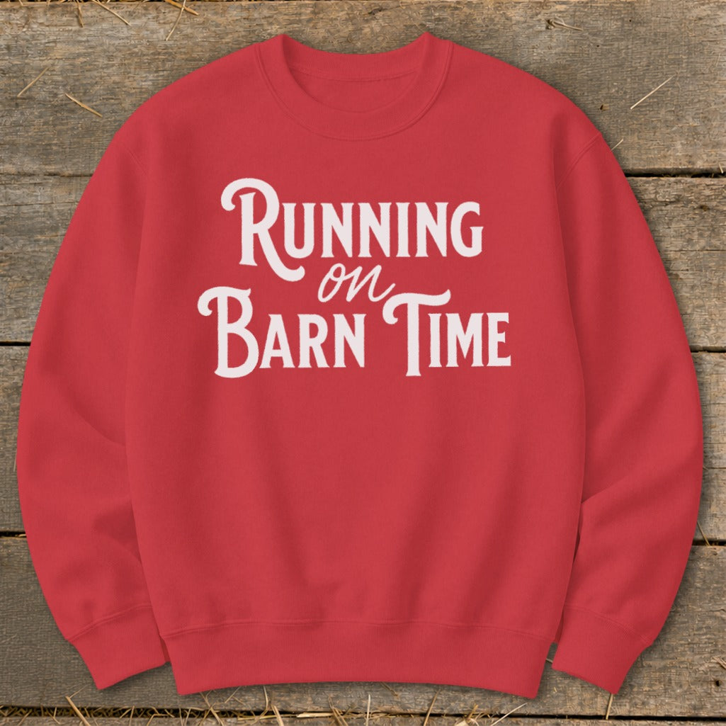 Red sweatshirt with white text "Running on Barn Time"