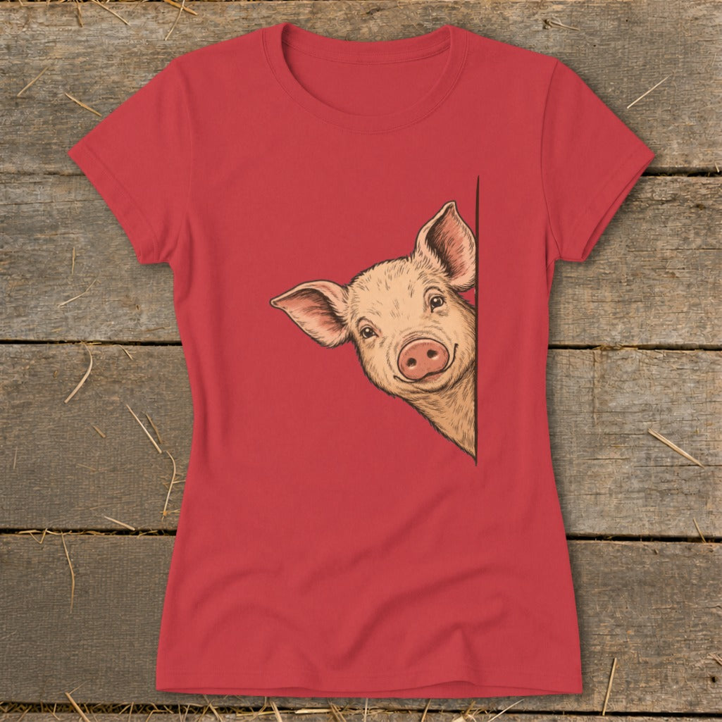Red t-shirt with a drawing of a smiling pig peeking from the side.