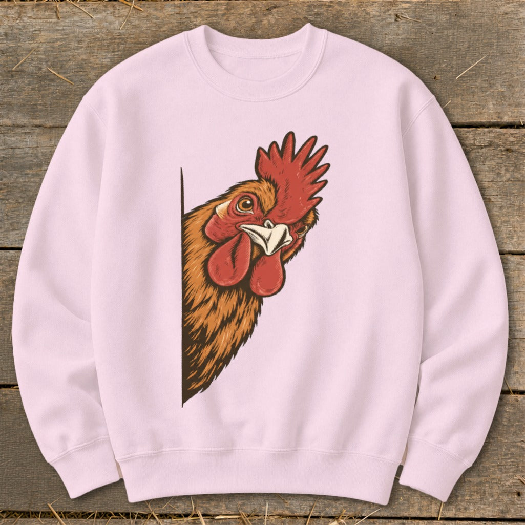 Pink sweatshirt with a cartoon rooster peeking from the side.