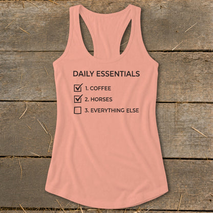 Peach tank top with "Daily Essentials" checklist: coffee, horses, everything else.