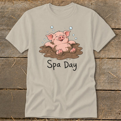 T-shirt with a happy pig relaxing in mud, text reads "Spa Day".