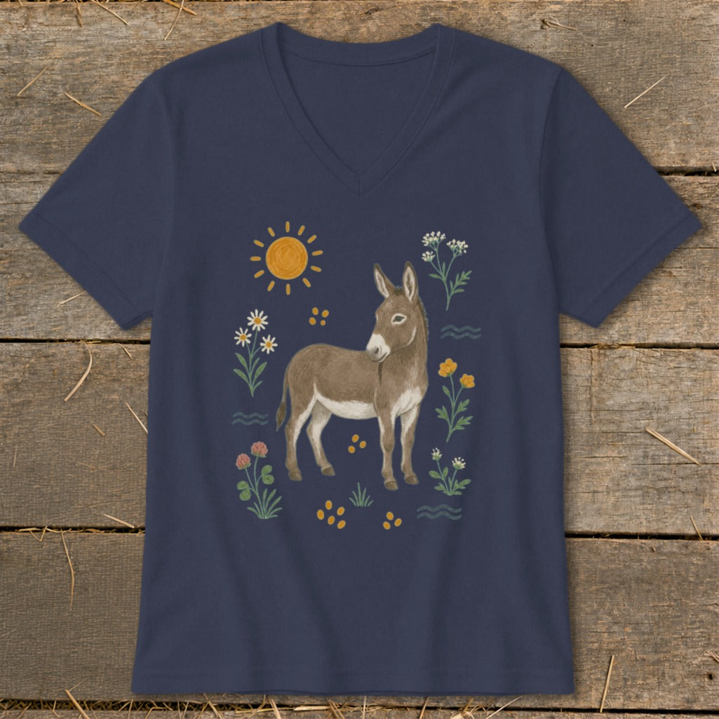 Donkey graphic with flowers, sun, and wavy lines on a navy blue t-shirt.