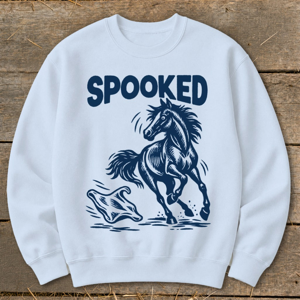 White sweatshirt with "SPOOKED" text, startled horse, and ghost graphic.