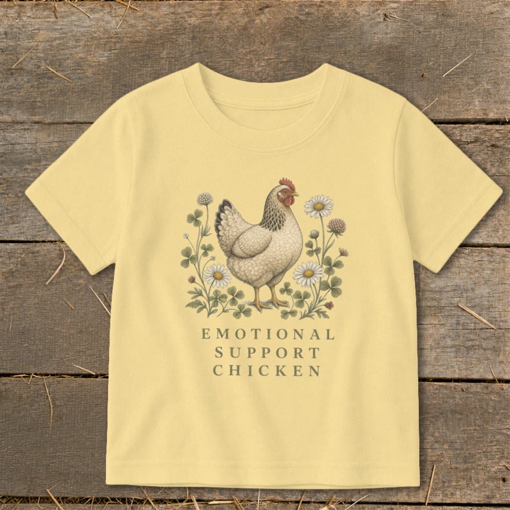 Light yellow t-shirt with a chicken illustration and "Emotional Support Chicken" text.