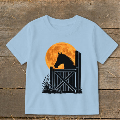 Light blue short-sleeved t-shirt featuring a graphic of a horse silhouette looking over a gate against a full moon.