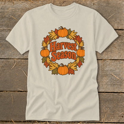 T-shirt with pumpkins, leaves, and "Harvest Season" text in a circular design.