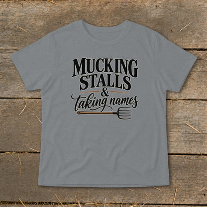 Grey t-shirt with "MUCKING STALLS & Taking names" and a pitchfork graphic.