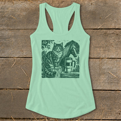 Green tank top with a dark green graphic of a cat, horse, and mug.