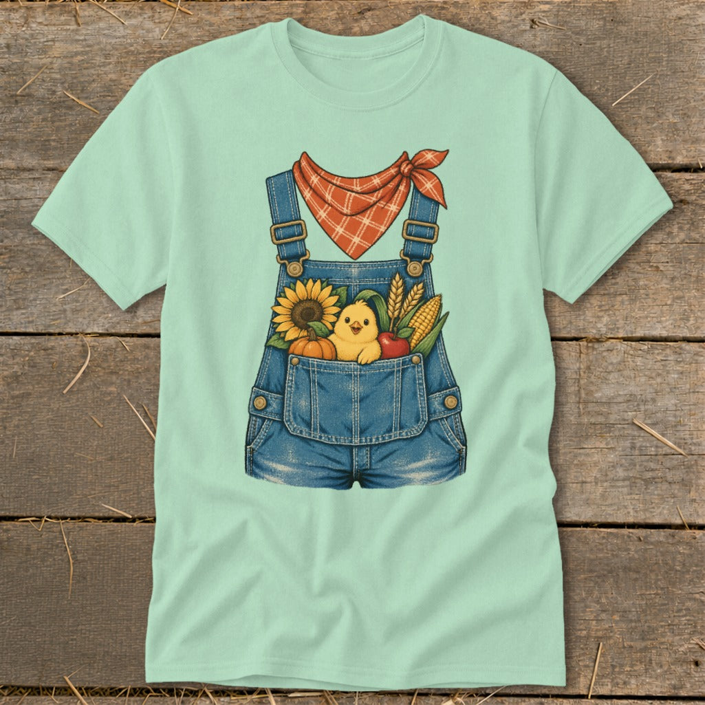 Light green t-shirt with denim overalls graphic featuring a chick and fall harvest.