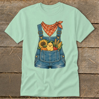 Light green t-shirt with denim overalls graphic featuring a chick and fall harvest.