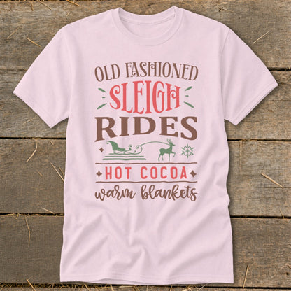 Light pink t-shirt with "Old Fashioned Sleigh Rides Hot Cocoa Warm Blankets" text.