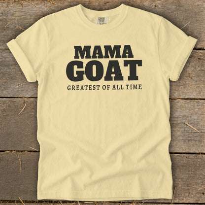 Light yellow t-shirt with black text "MAMA GOAT GREATEST OF ALL TIME".