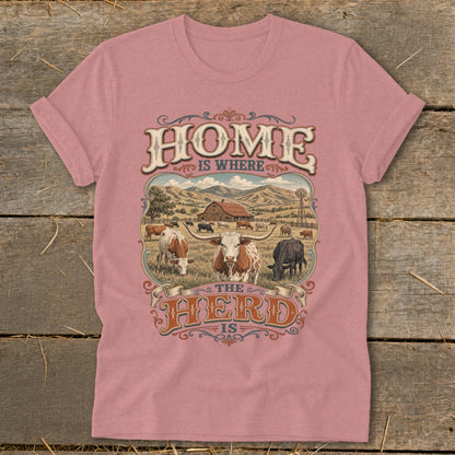 Pink t-shirt with "HOME IS WHERE THE HERD IS" text and farm scene graphic.