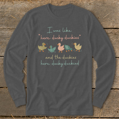 Long sleeve shirt with a graphic of ducklings and text about duckies.