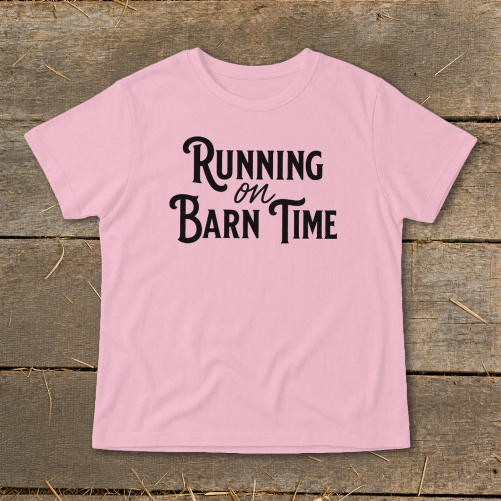 Pink t-shirt with black text that reads "Running on Barn Time".