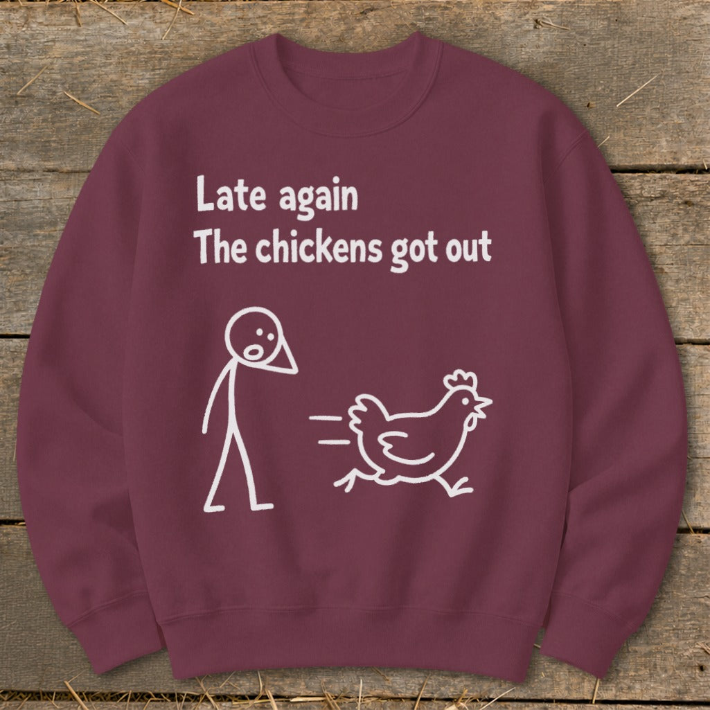 Maroon sweatshirt with white text "Late again The chickens got out" and cartoon.