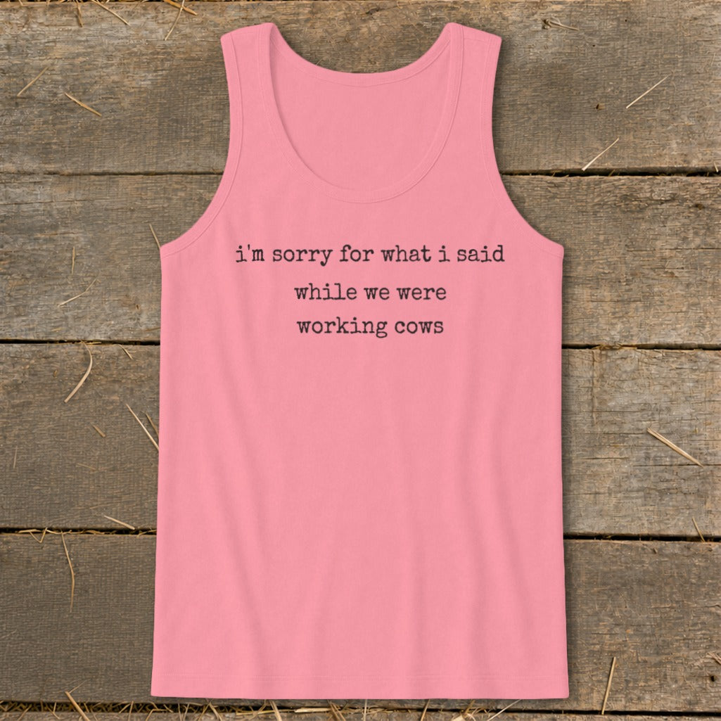 Pink tank top with black text: "i'm sorry for what i said while we were working cows".