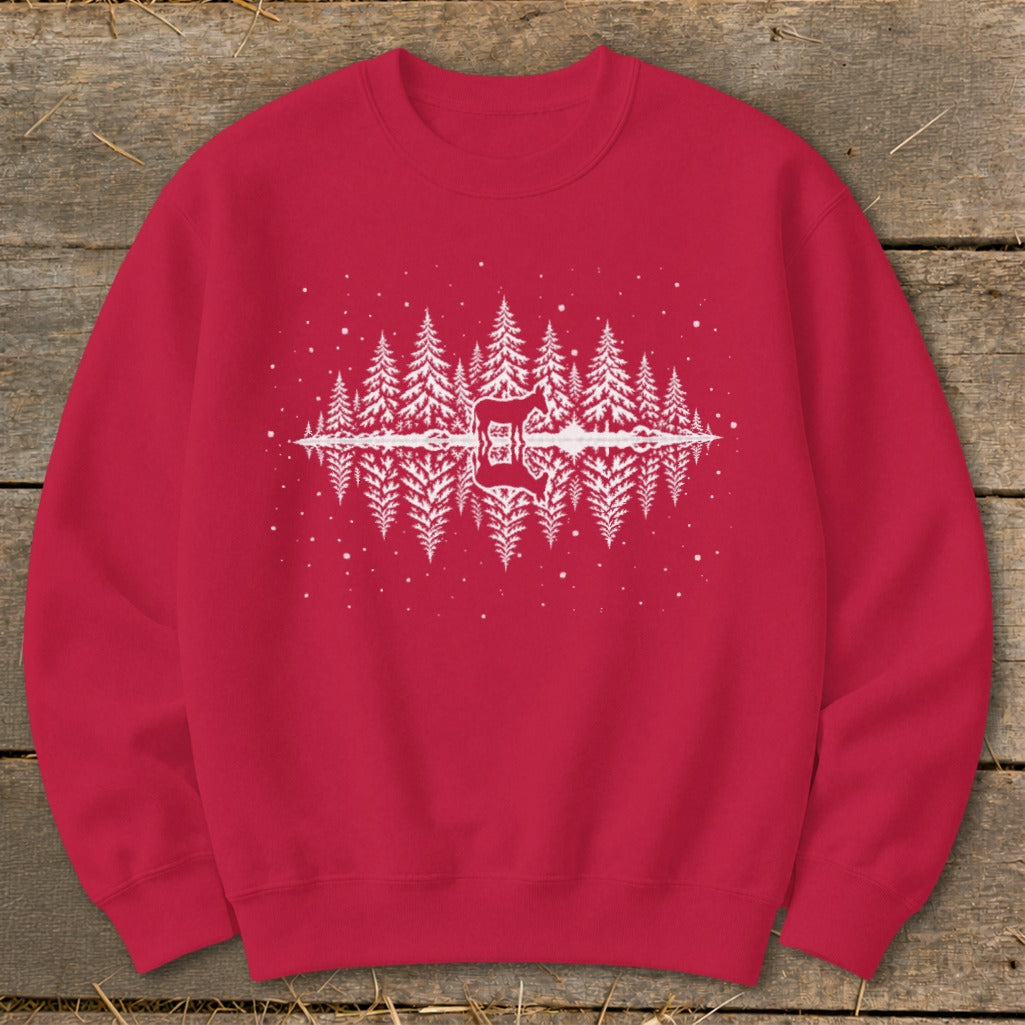 Red crewneck sweatshirt with white forest and deer reflection graphic.