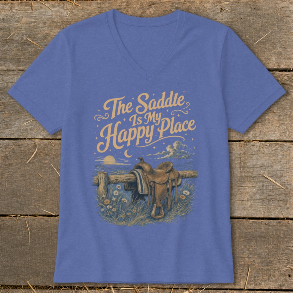 T-shirt with "The Saddle Is My Happy Place" text and western saddle on fence.