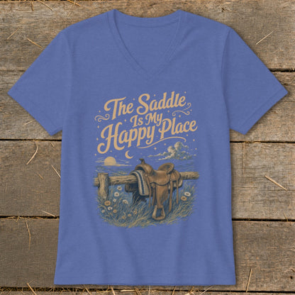 T-shirt with "The Saddle Is My Happy Place" text and western saddle on fence.