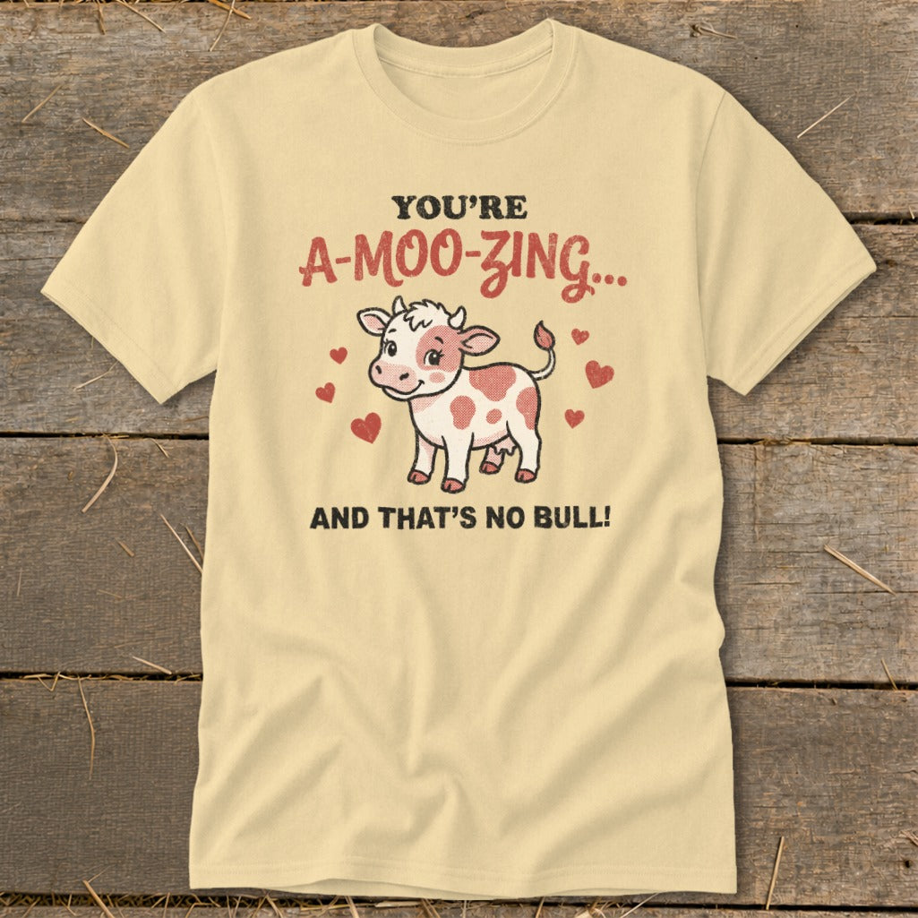 Light yellow t-shirt with a cartoon cow and text "You're A-Moo-Zing... And That's No Bull!"