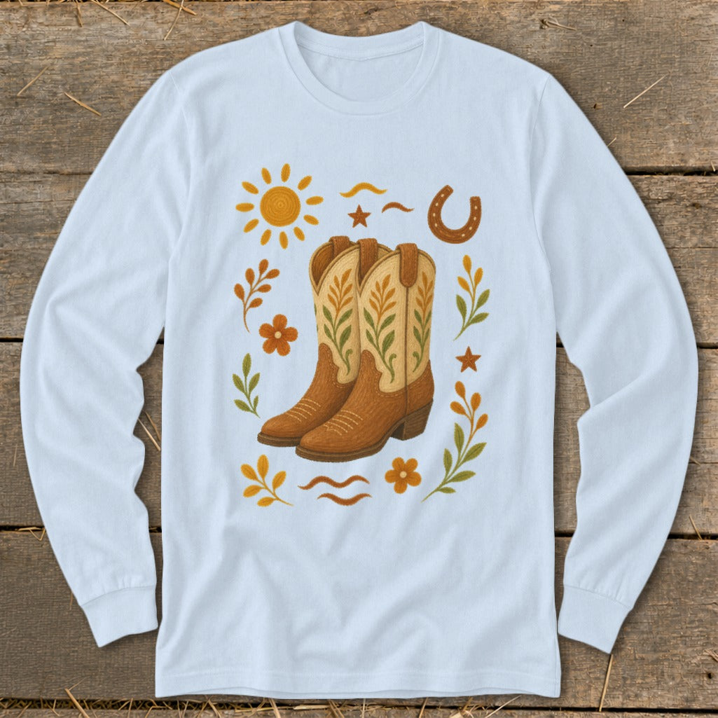 Light blue long-sleeve shirt with cowboy boots and western-themed embellishments.