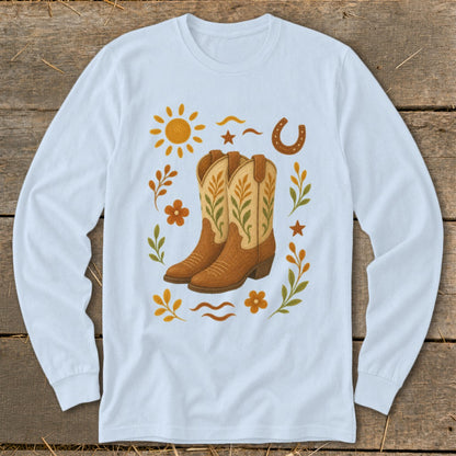 Light blue long-sleeve shirt with cowboy boots and western-themed embellishments.