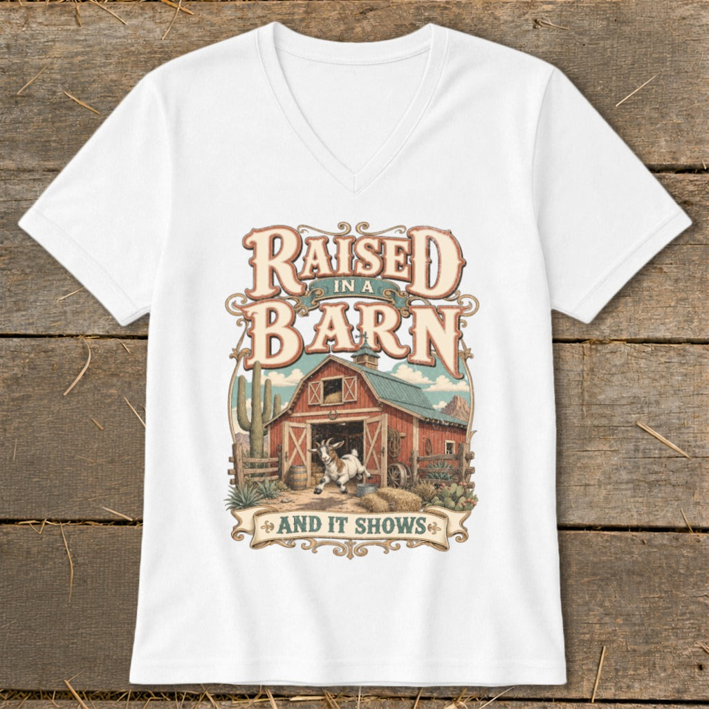 White t-shirt with "Raised in a Barn And It Shows" text and barn graphic.