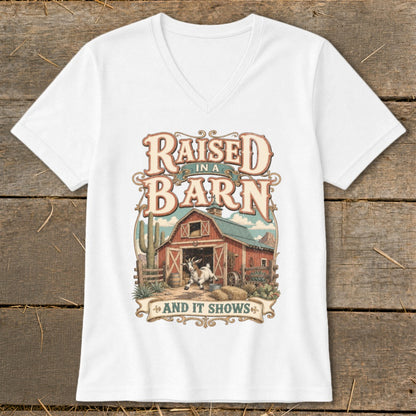 White t-shirt with "Raised in a Barn And It Shows" text and barn graphic.