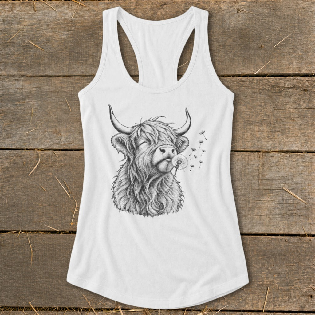 White tank top with a sketch of a Highland cow blowing a dandelion.