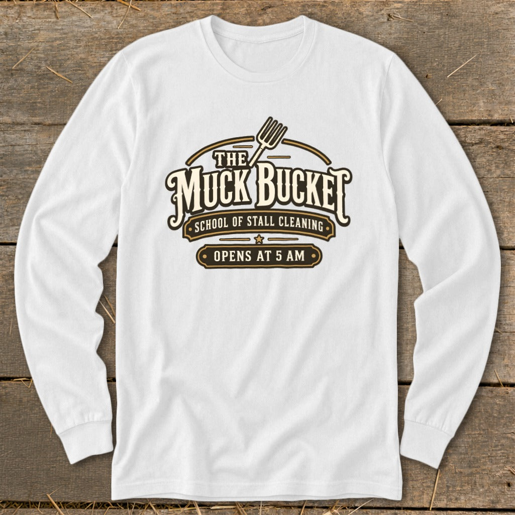 White long-sleeved shirt with "The Muck Bucket School of Stall Cleaning Opens at 5 AM" graphic.