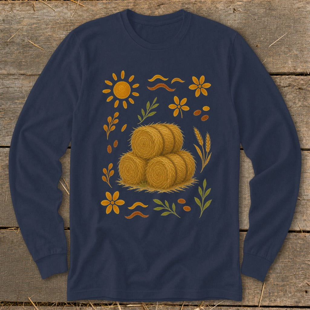 Navy long-sleeve shirt with a stacked hay bale graphic surrounded by autumn foliage and sun.