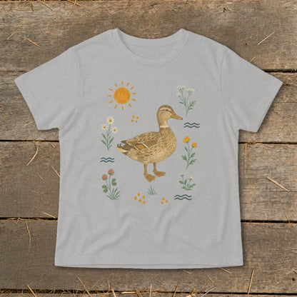 Grey t-shirt with a watercolor illustration of a duck surrounded by flowers and the sun.