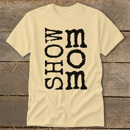 Pale yellow t-shirt with black text that reads "SHOW MOM" vertically.