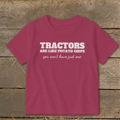 T-shirt with white text "Tractors are like potato chips you can't have just one."