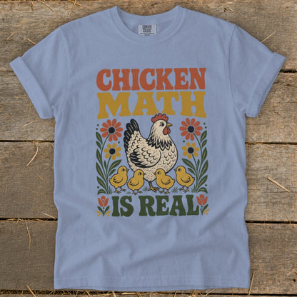 Light blue t-shirt with "CHICKEN MATH IS REAL" and illustrations of a hen with chicks and flowers.