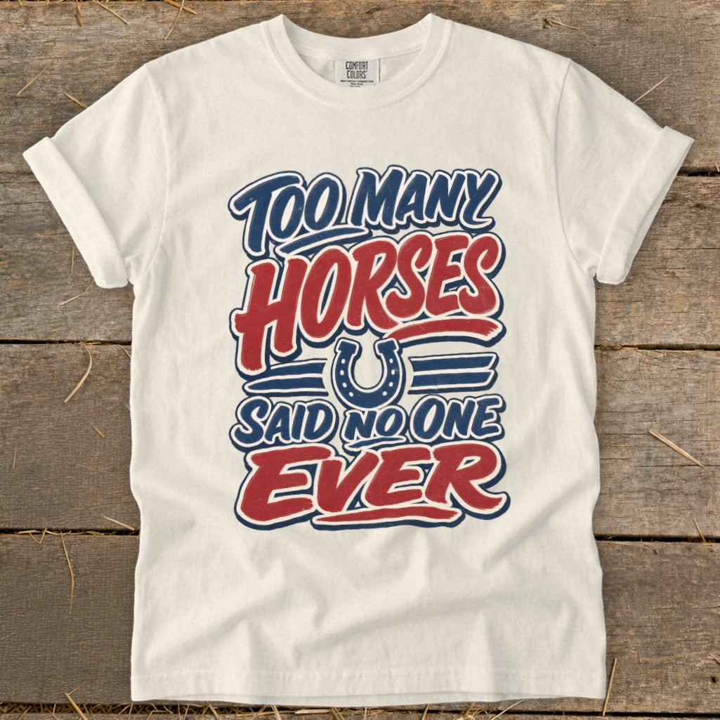 Cream t-shirt with "Too Many Horses Said No One Ever" graphic and horseshoe.