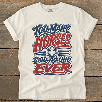 Cream t-shirt with "Too Many Horses Said No One Ever" graphic and horseshoe.
