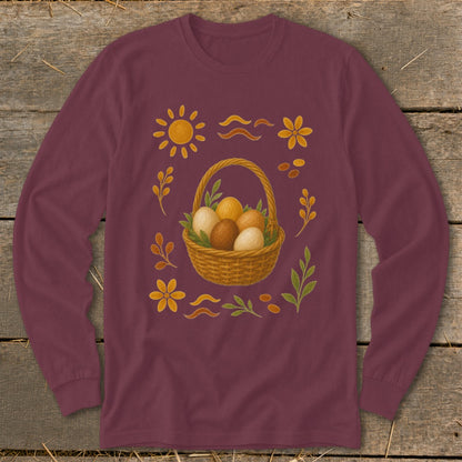 Long-sleeved maroon shirt with Easter basket and decorative elements.